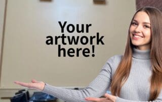 Image of a femme presenting person with long light brown hair gesturing to an empty beige wall with the text overlay "Your artwork here!"