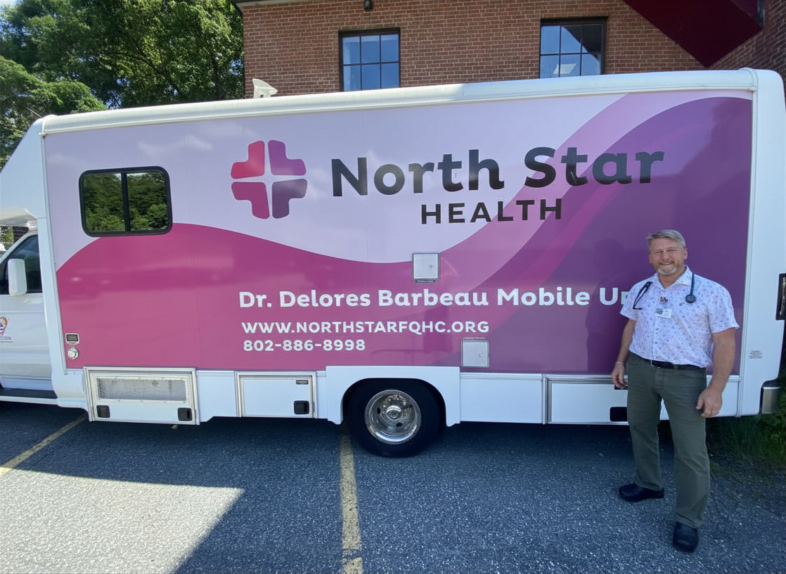 Will Hoser PA-C in front of the North Star Mobile Health Unit
